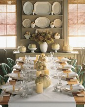 neutral pumpkins, painted pears and neutral pillar candles will give a refined fall touch to the dining room