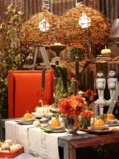 orange and neutral pumpkins, bright blooms and pendant lamps covered with twigs and berries for the fall