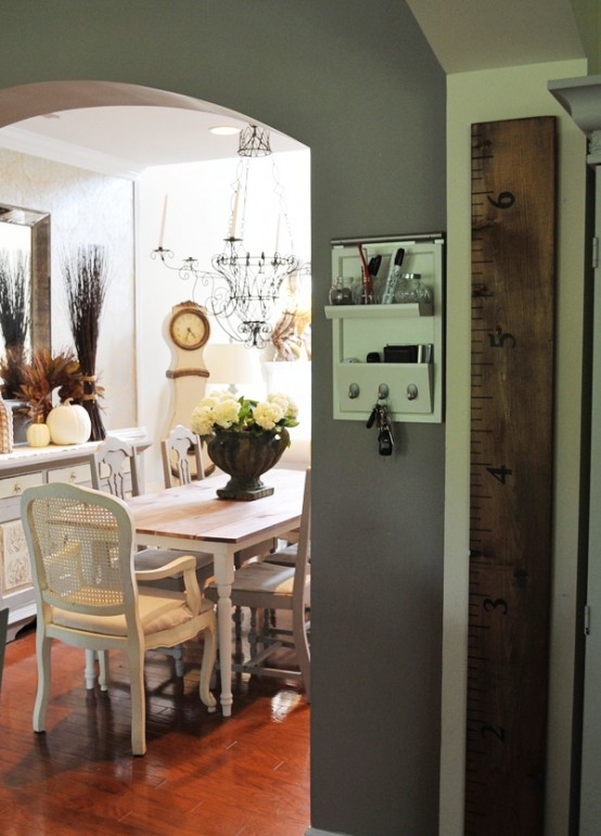 some white pumpkins, a branch arrangement, a dried leaf wreath for a fall feel in the dining room