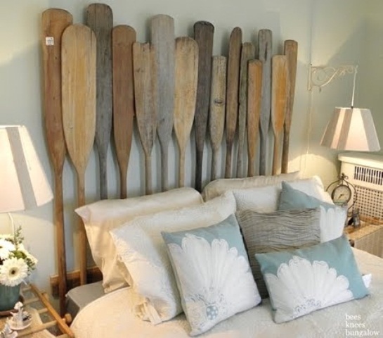 DIY headbaord made of used wooden oars is a nice repurposing project that fit the theme nicely.