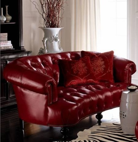 a burgundy tufted sofa with a refined design is a stylish fall-like statement for a living room