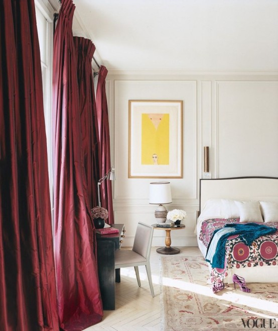 burgundy curtains make a bold statement in the neutral space and add a fall feel to the space
