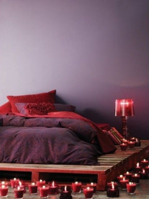 burgundy candles, a lamp and textiles will add a berry touch to the bedroom