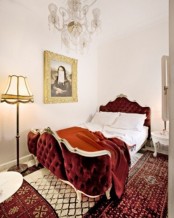 a refined burgundy velvet bed with curved parts looks amazing and very welcoming