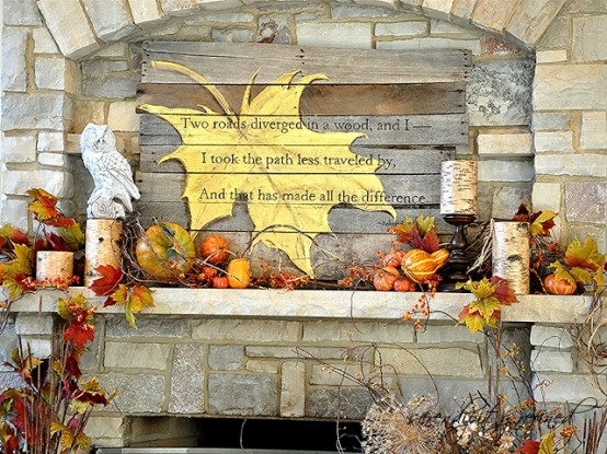 a vintage fall mantel decorated with faux berries, pumpkins, candles, birch branches and owls