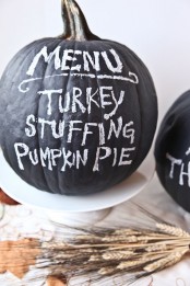 a chalkboard pumpkin can be used as a Thanksgiving party menu or you can chalk something else on it