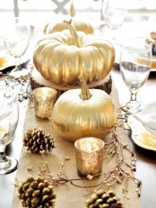 gold pumpkins and pinecones with glitter edges are amazing to decorate your Thanksgiving table