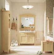 a beige, taupe and creamy bathroom with rustic vintage furniture, cool textiles and a window