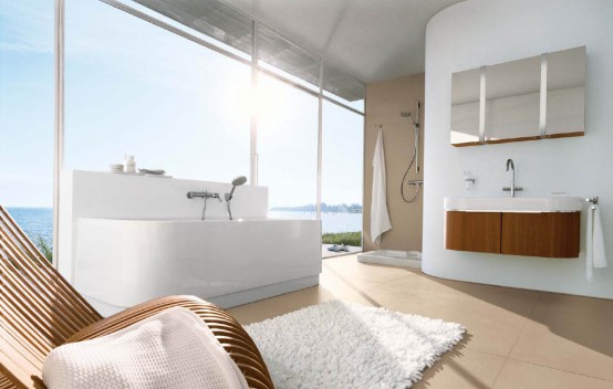 a gorgeous white and taupe bathroom with rich-colored furniture, a glazed wall and stainless steel appliances