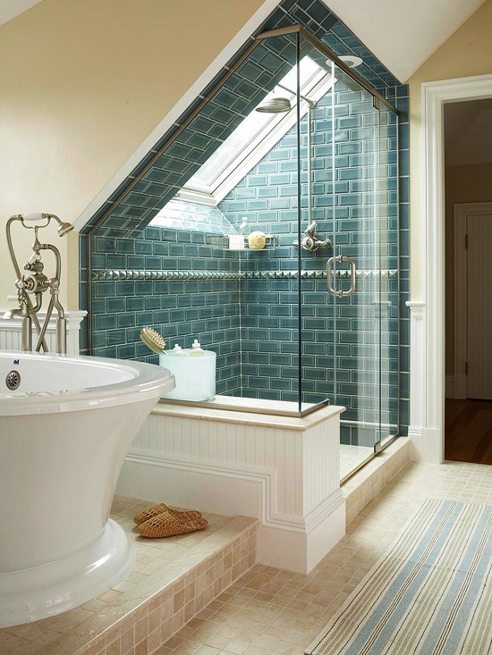 a beige and taupe bathroom done with paint and tiles, a large bathtub, a turquoise shower space and a striped rug