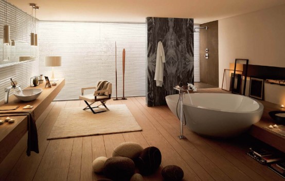 a beige bathroom and a darker beige wooden floor, white textural walls and a large bathtub