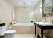 a beige and white bathroom with dark touches is a stylish modern space to rock
