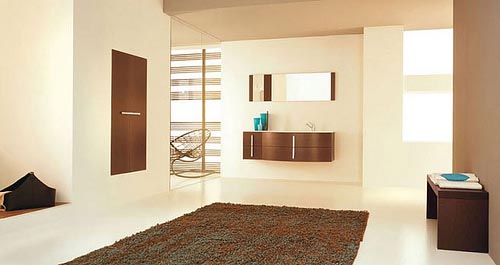 a taupe, rich brown and white bathroom with much light and mirror to reflect it