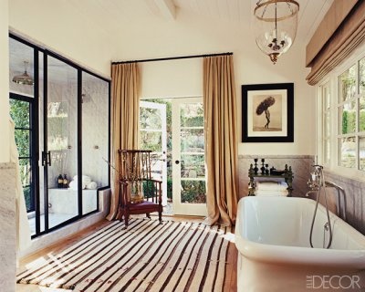 a taupe and brown refined vintage bathroom and touches of black for a dramatic accent