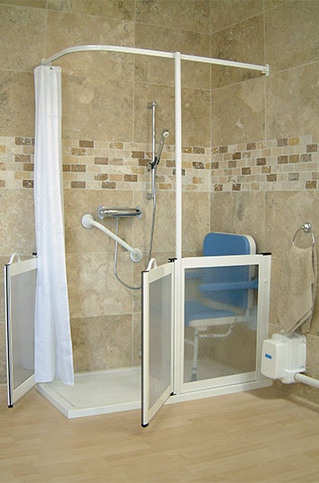a beige and taupe bathroom with a white shower clad with glass only on half