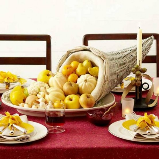 a fantastic cornucopia Thanksgiving centerpiece with pearls, gourds and onions is a fab idea for this holiday