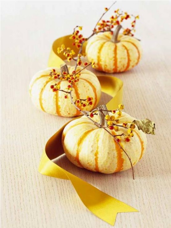 a very easy Thanksgiving centerpiece of gourds, berries and a mustard ribbon is a perfect last-minute idea to rock