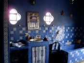 navy walls, bold blue mosiac tiles with a touch of gold for a Moroccan-themed bathroom