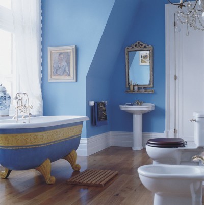 a serenity blue bathroom with gold touches and whiet items plus whimsy and catchy decor