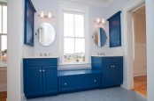 bright blue beadboard furniture and panels and a light blue penny tile floor