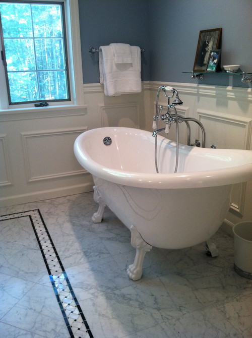 blue walls with white paneling are an elegant combo for any vintage bathroom