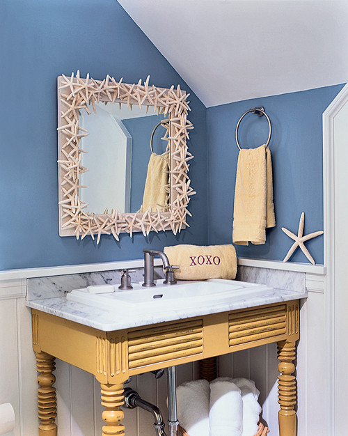 a blue and white beadboard wall for a seaside bathroom, starfish for additional decor