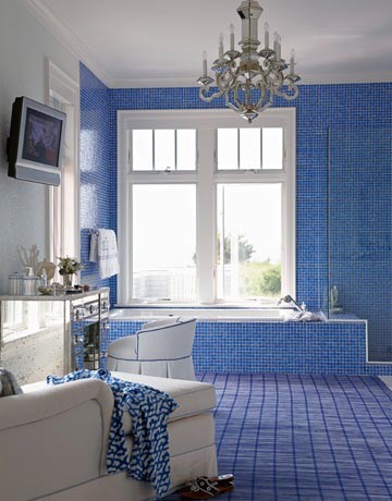 a bright blue tile bathroom is a very bold idea, a matching rug with a vindwopane print