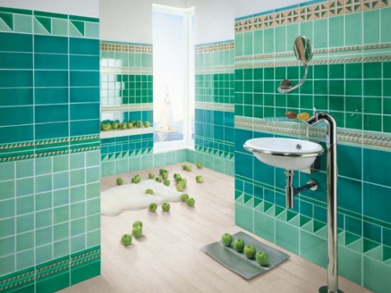 a catchy turquoise and green bathroom with patterned tiles