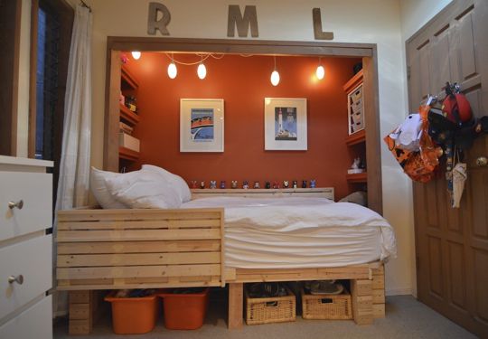 A platform wooden bed in a niche would become a perfect sleeping nook for your boy.