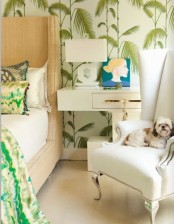 tropical leaf print wallpaper is a timeless idea to turn your bedroom into a tropical oasis, and a neutral upholstered bed matches