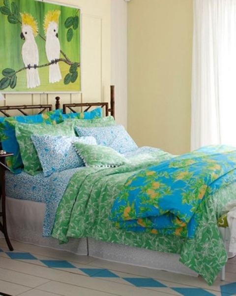 bright bedding and a colorful parrot artwork will turn your bedroom into a tropical oasis easily and fast