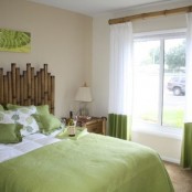 a bamboo headboard and curtain rod, bright green touches for a contemporary and fun bedroom