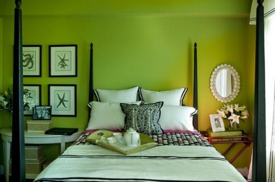 neon green walls, dark stained and white furniture, tropical blooms and a mother-of-pearl mirror