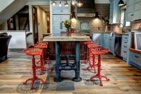 brutal kitchen island pipe legs and cute red chairs are definitely a focal point of this kitchen