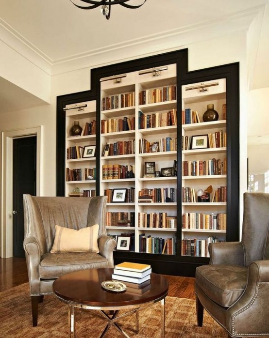 a refined living room with a whole cluster of built-in bookshelves framed in black is a very elegant and stylish piece