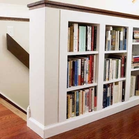 bookshelves built into railings are a nice way to accent the staircase and store some books