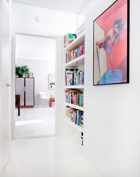 a little awkward nook with built-in shelves is a stylish and smart way to store your books and save soem space