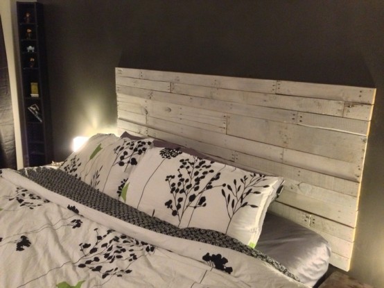 if there's no headboard, you can make one and attach it to the wall, use whitewashed wood to create such a headboard