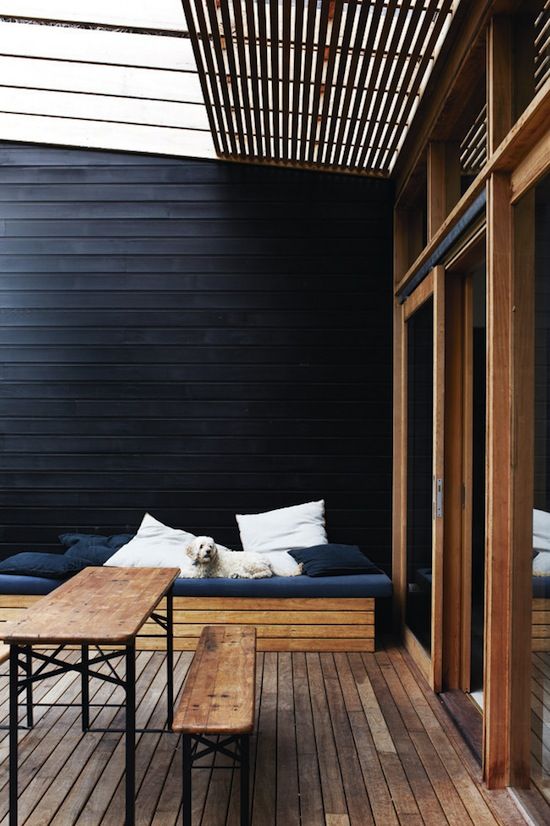 a Scandi terrace under the roof, with a stained bench with black upholstery, a stained dining table and benches is a lovely idea for summer a Scandi terrace under the roof, with a stained bench with black upholstery, a stained dining table and benches is a lovely idea for summer