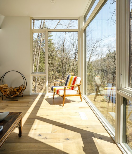 Cantilevered Lake  Cottage  With Airy White Oak  Interiors 