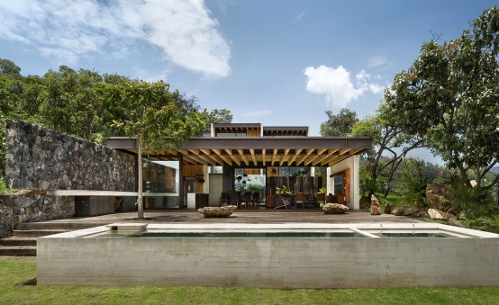 Cascading Mexican House Embedded In A Hilltop Setting