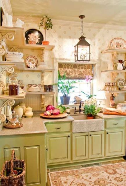 a vintage pastel kitchen with green cabinets, open shelves instead of upper cabinets, a black lamp and a pritned rug