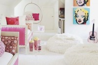 a pop art inspired white girls’ bedroom with daybeds, bright artworks, open shelves, fluffy poufs and touches of bold pink and turquoise