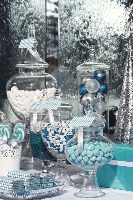 a Christmas candy buffet with white, blue and bold blue candies, chocolate and other tasty things is amazing