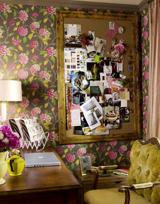 a bold vintage home office with dak floral wallpaper, a vintage mustard chair, yellow accessories and bright fuchsia blooms