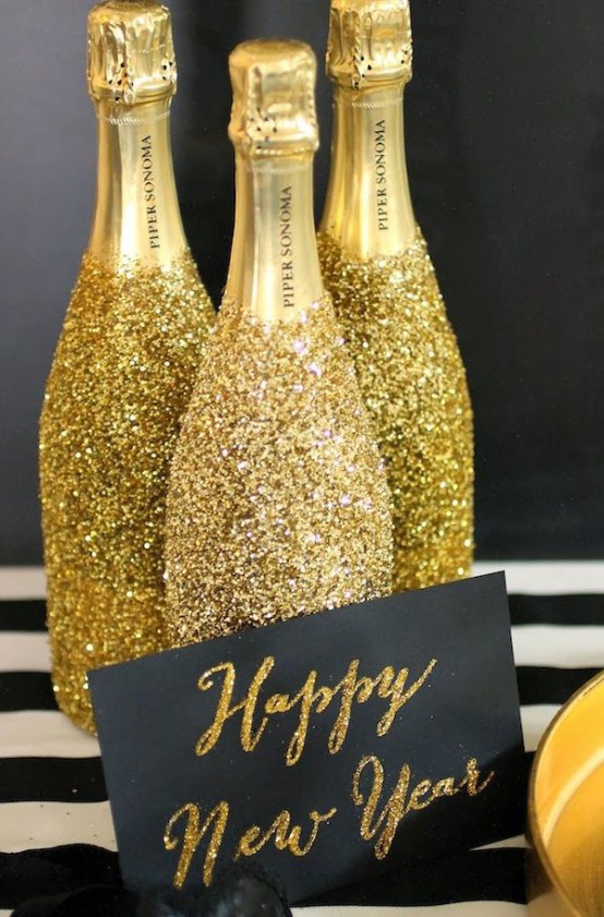bubbly bottles done with gold glitter are amazing for your party, they will add a cheerful and cool feel to your NYE celebration