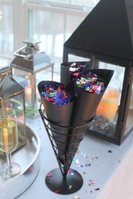 black cones with colorful confetti can be rocked at a NYE party and you may sprinkle your party with bright confetti on the dance floor