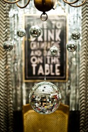 hang some silver disco balls on your chandeliers and lamps and they will instantly create a party feel in the spaces