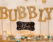 design a bubbly bar with shiny ornaments, tinsel and gold glitter letters on sticks and it will look ultimate