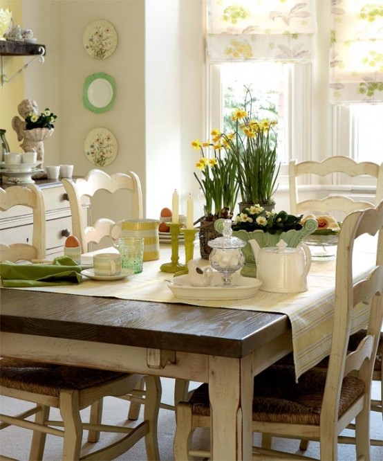 a neutral kitchen with a dining zone and touches of green and yellow here and there to make the space brighter and cooler